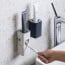 Dispensador Pasta de Dientes de pared blanco